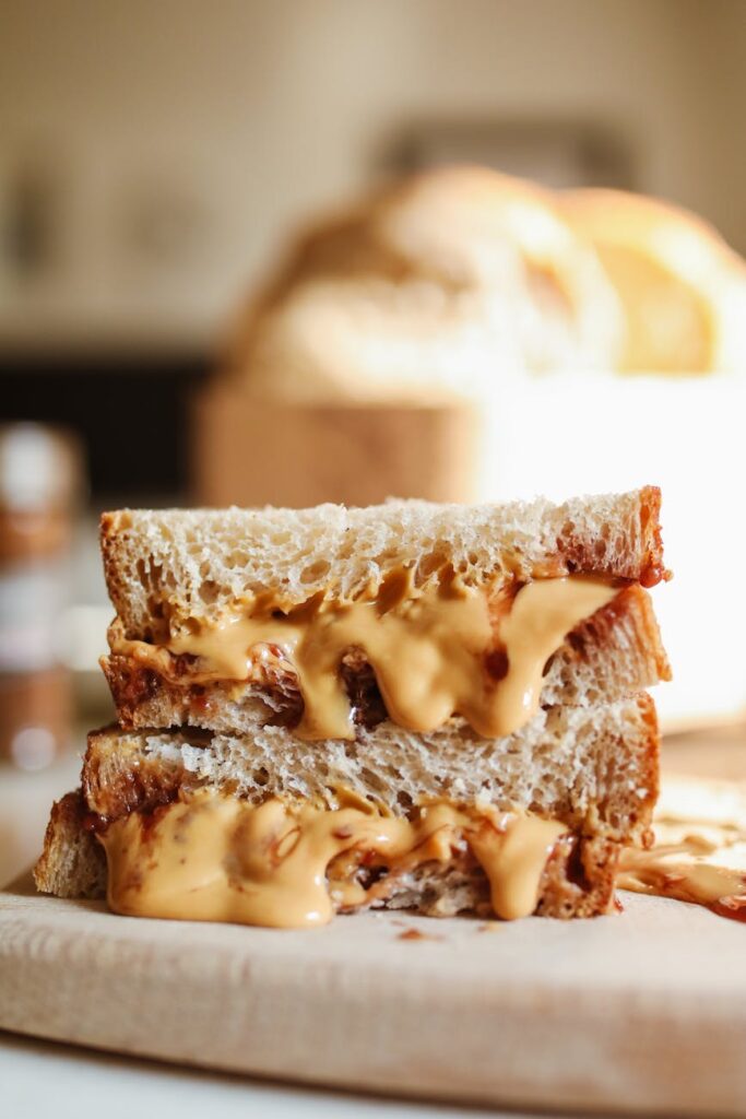 sandwich slice with creamy peanut butter spread energy dense