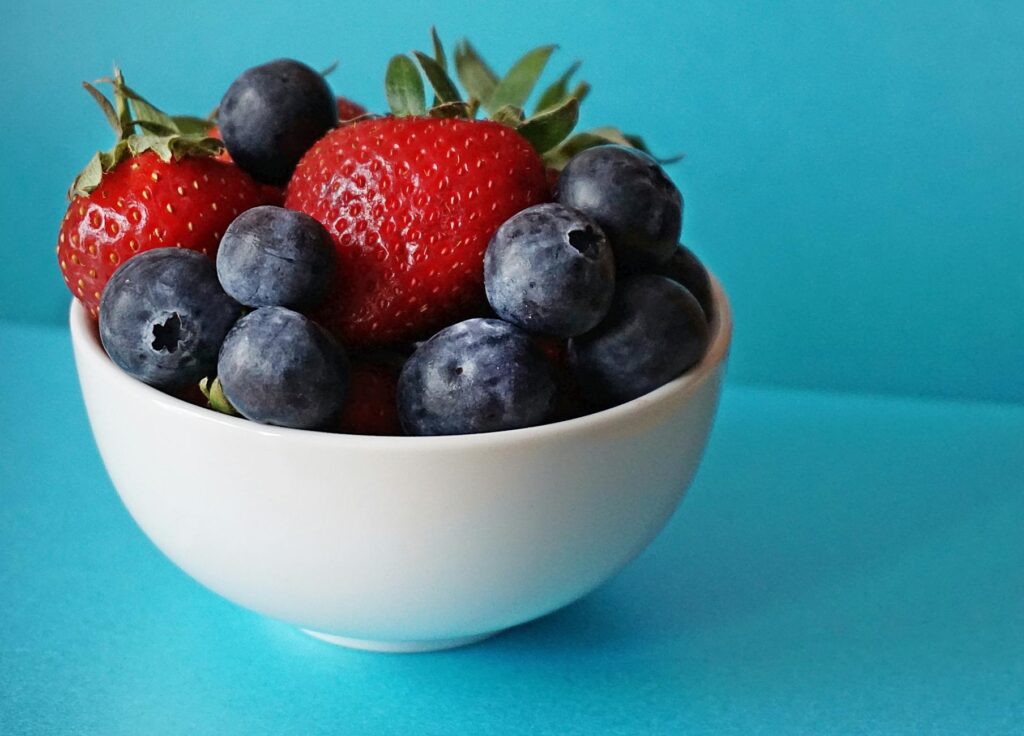 blueberries and strawberries in white ceramic bowl allergy snacks