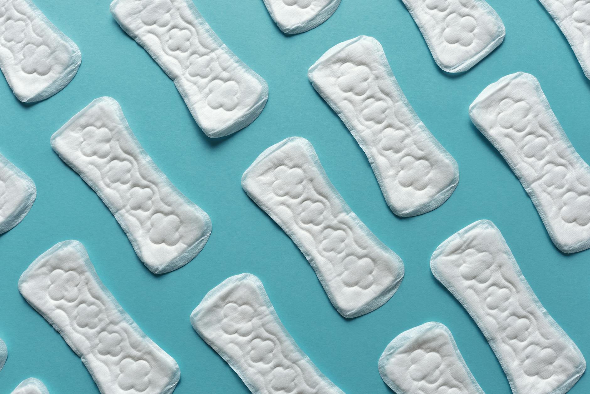 menstrual pads on blue background athlete period