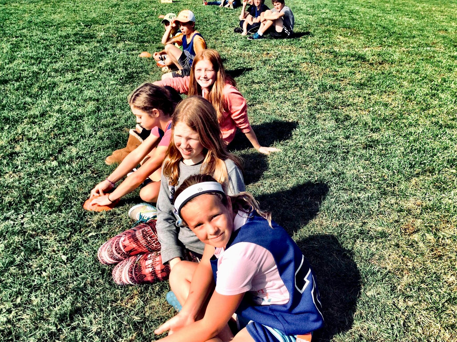 photography of people on grass field