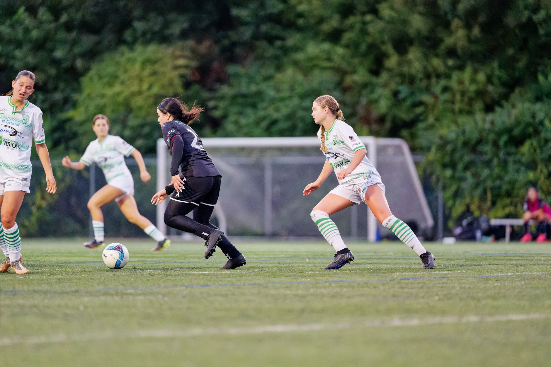 women s soccer players in action on the field